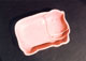 ピンクの陶器の石鹸置き